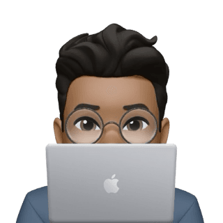 Person peeking from behind the laptop